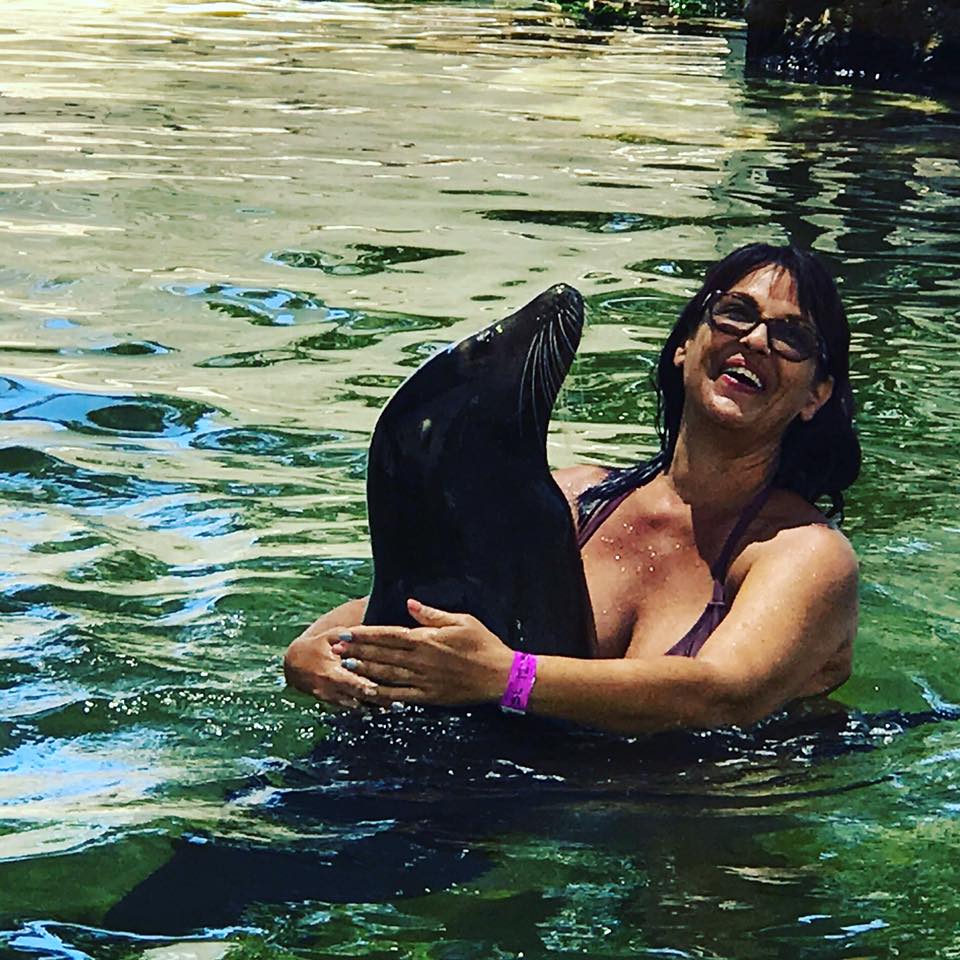 Barb hugs Bella, the Sea Lion