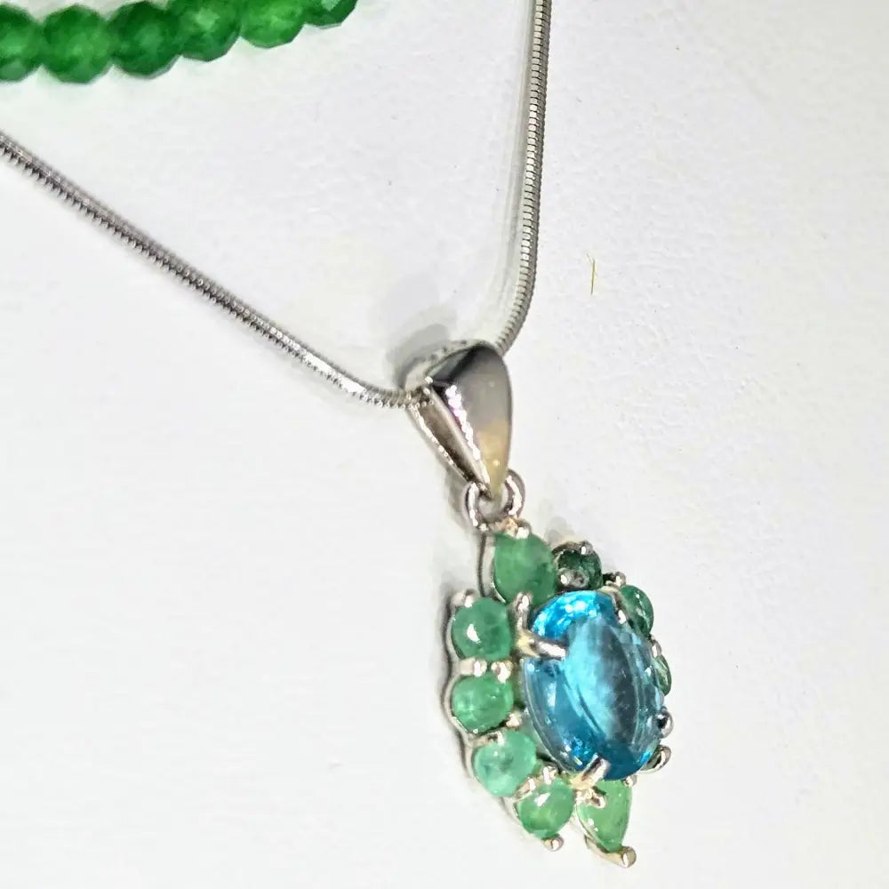?CAribbean Dreams’.75’’ Pendant Necklace - Paraiba Blue Topaz & Emerald Anti-tarnish Sterling