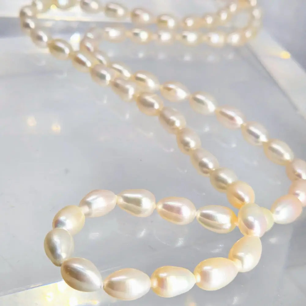 ?MIlk Man Rings Twice’ 32’’ Necklace - Pearls Enhancer Clip
